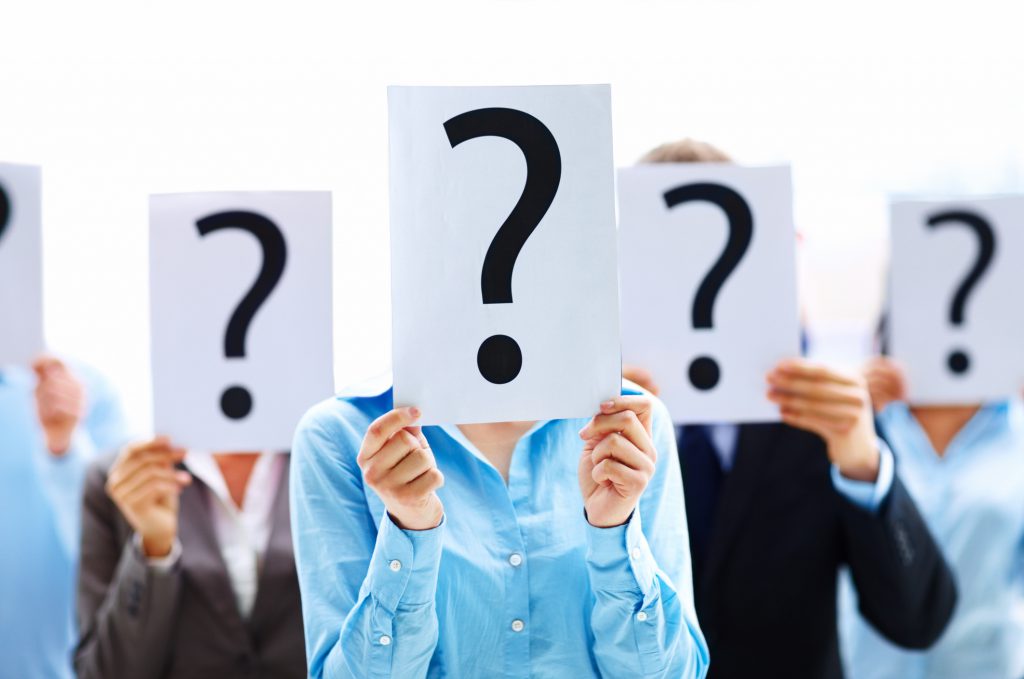 Colleagues holding question mark signs in front of their faces Business software, CRM, Drill-in, ERP, Export to Excel, Flexibility, Lookup, M18, Query, Report, Reporting, Reports, Singapore, User-defined Fields, Workflow