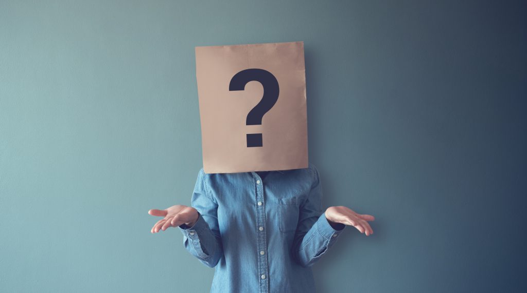 Woman has Confused, Thinking, Question Mark Icon on Paper Bag, copy space. Difference between ERP and POS, ERP system in Singapore