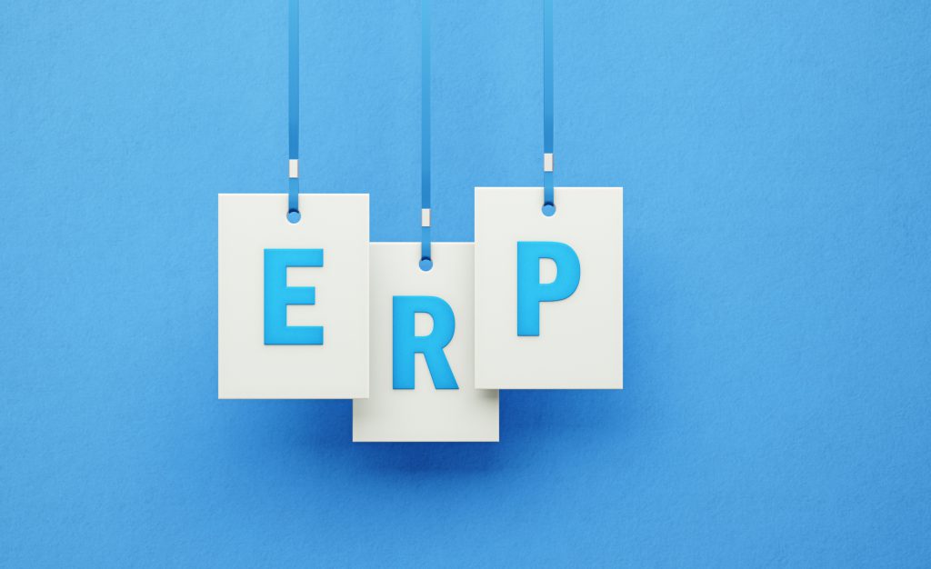 ERP Writes on White Square Shapes Hanging from Blue Ribbons over Blue Background erp system in singapore