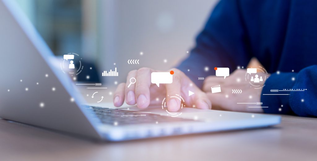 close up on man hand using tab pad on laptop to working about futuristic of social media marketing icon for internet network technology and business concept HR system in Singapore, Multiabe, ERP system in Singapore