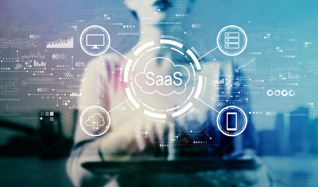 SaaS - software as a service concept with businesswoman using a tablet
