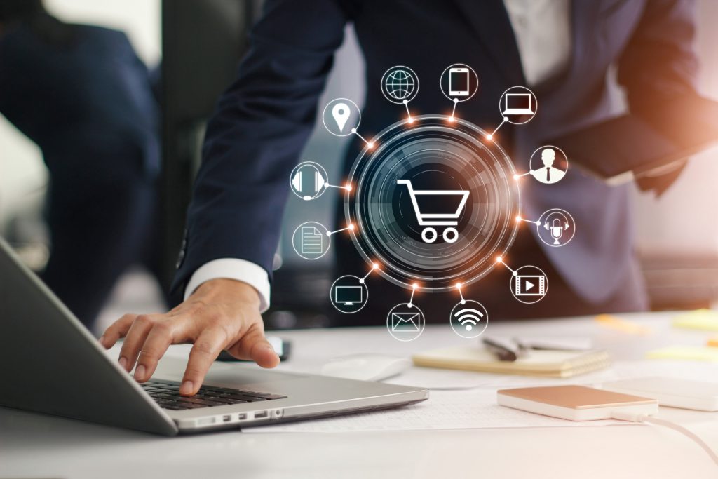 Digital marketing. Businessman working with laptop computer, tablet and smart phone. Modern interface payments online shopping and icon customer network connection on virtual screen. Business innovation technology concept. Seven eCommerce Strategies to Win the Competition