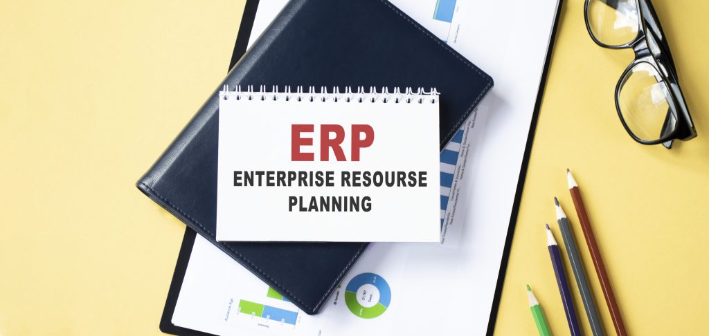 ERP, on the tablet pc screen held by businessman hands - online, top view What is the Purpose of ERP Software?