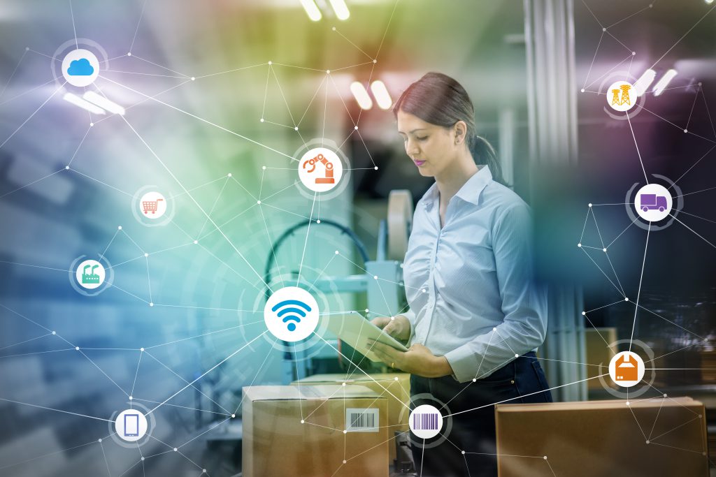 industry and Internet of Things concept. woman working in factory and wireless communication network. Industry4.0. ERP(Enterprise Resource Planning) System in Singapore