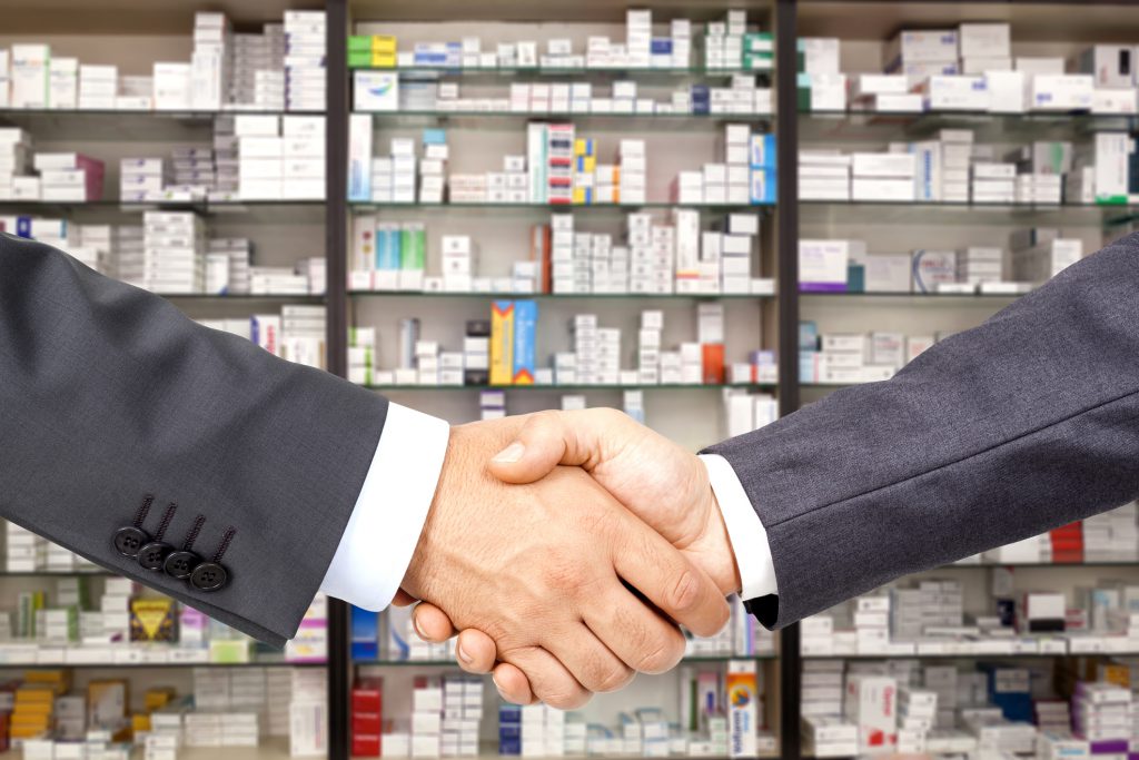 deal in the pharmacy background Handshake in the pharmacy backgroundERP(Enterprise Resource Planning) System in Singapore