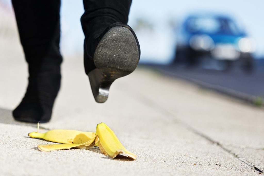 Female foot approaches banana skin; painful accident coming her way ERP System in Singapore